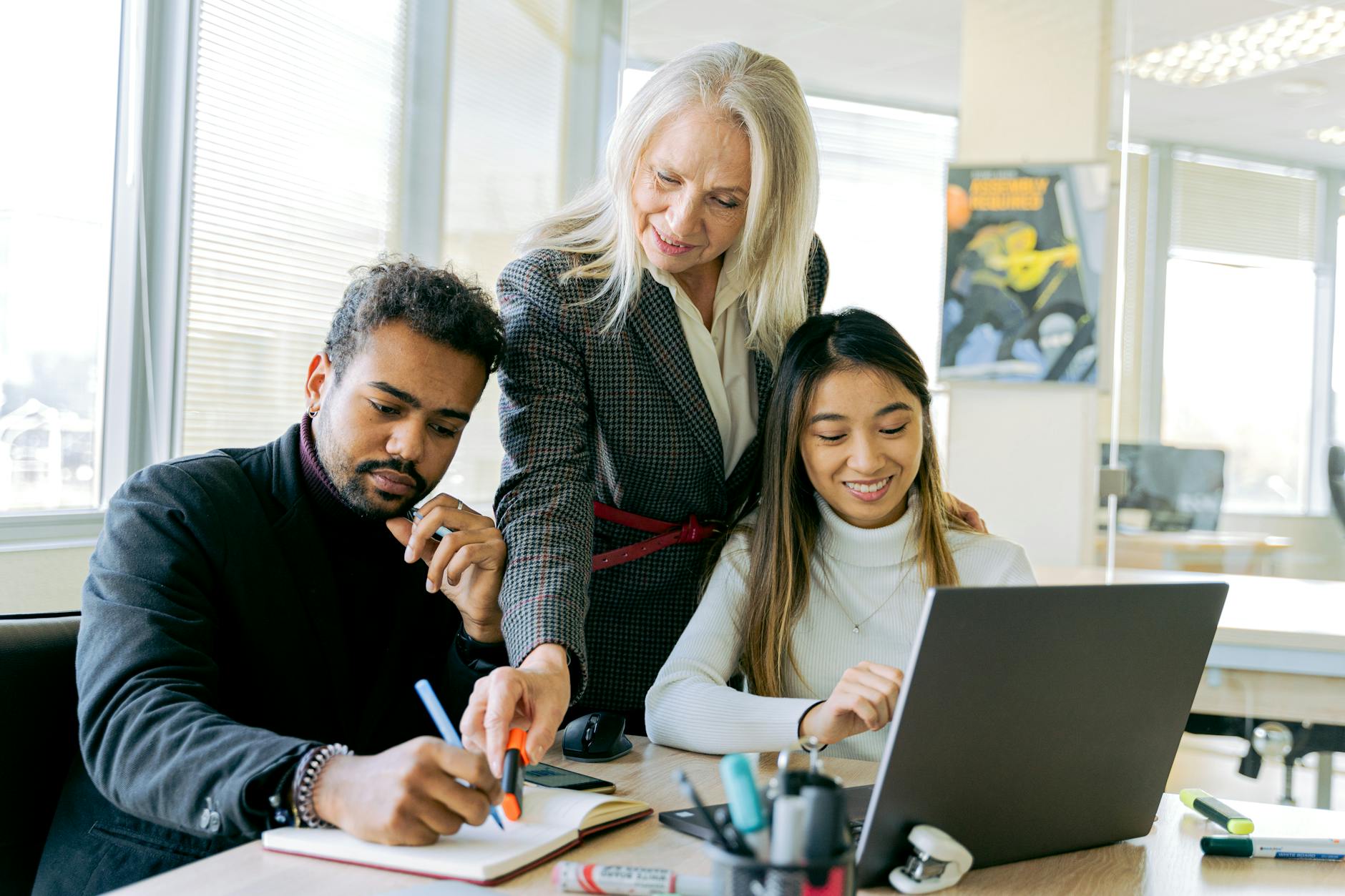 a group of people having a meeting in the office